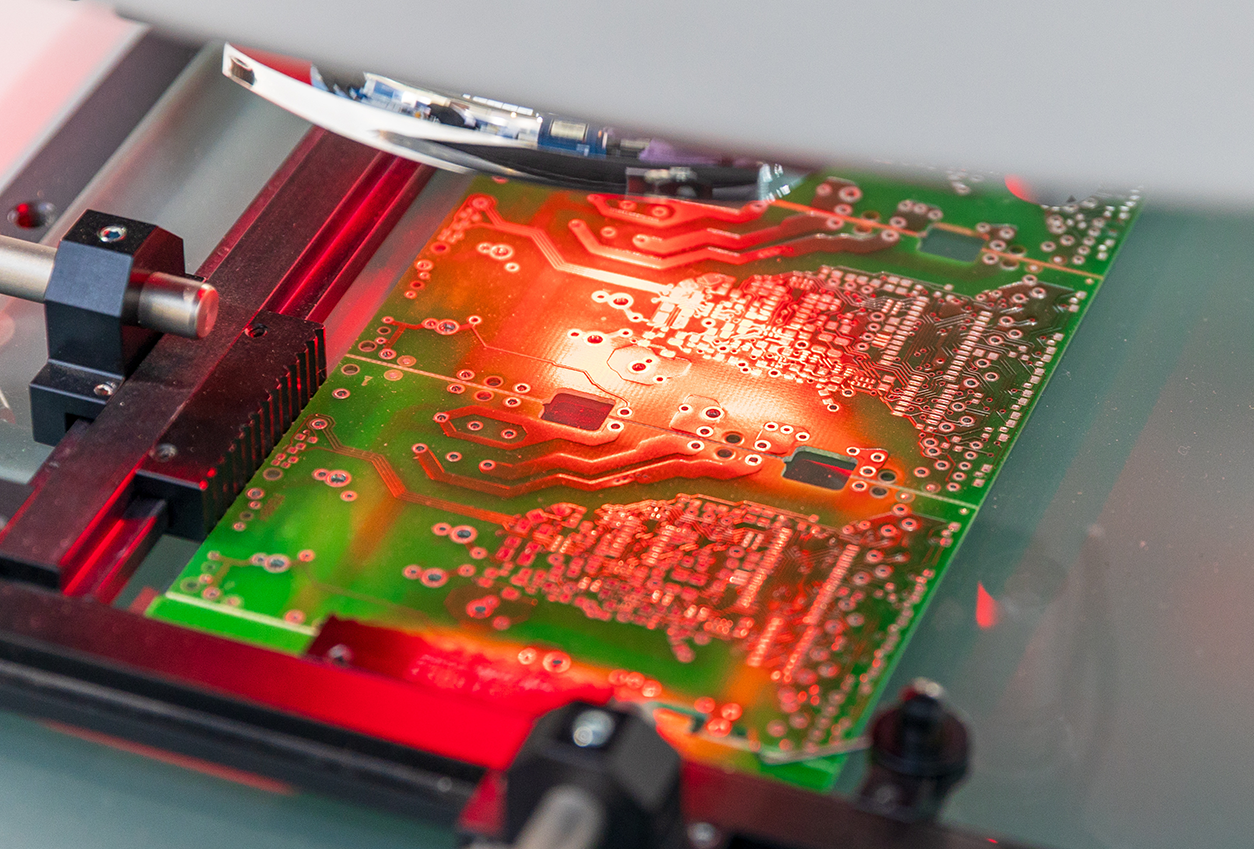 Close up of circuit board undergoing Automated Optical Inspection (AOI) by PCBA manufacturer