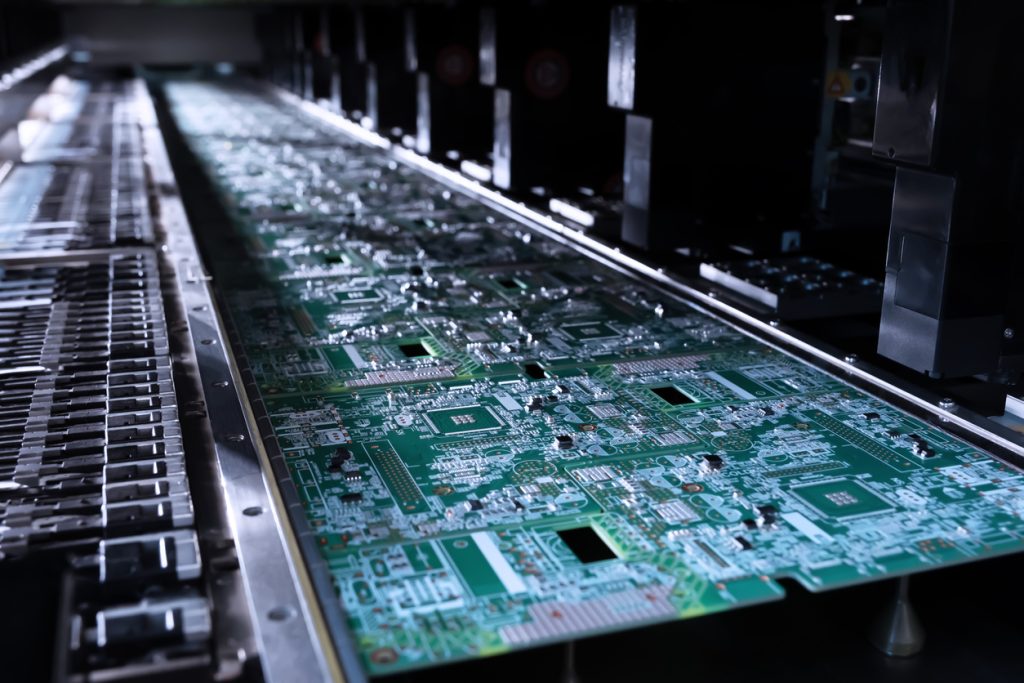 A closeup of the surface mount contract manufacturing process